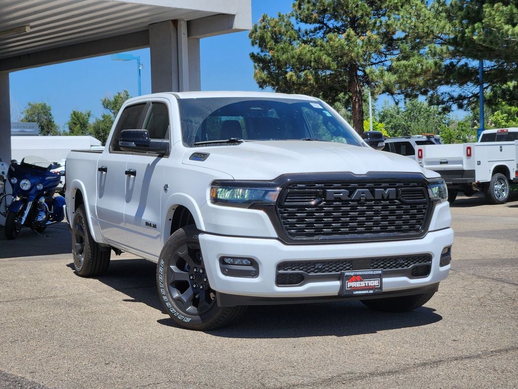 2026 RAM 1500 RAM 1500 BIG HORN CREW CAB 4X4 5'7' BOX in Bright White Clear-Coat Exterior Paint — front three-quarter view