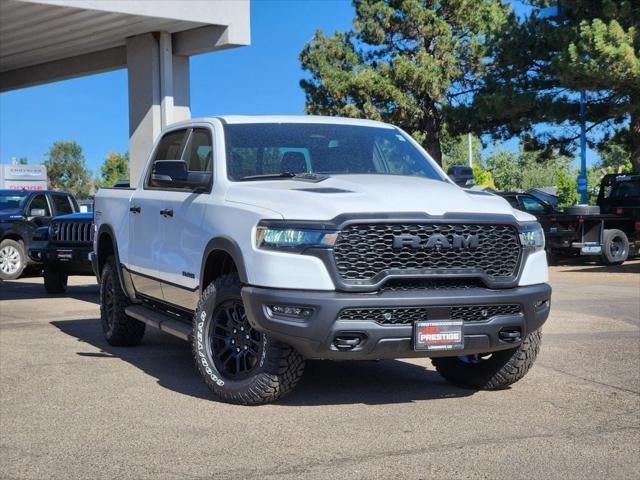 2026 RAM 1500 RAM 1500 REBEL CREW CAB 4X4 5'7' BOX in Bright White Clear-Coat Exterior Paint — front three-quarter view