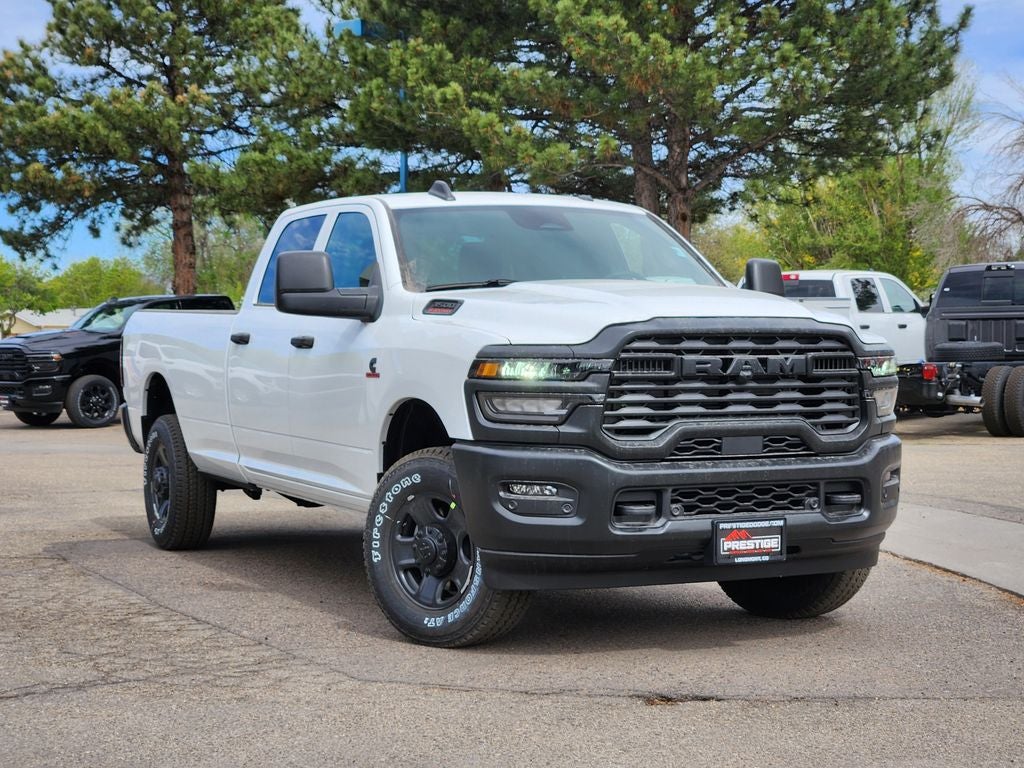2026 RAM 3500 RAM 3500 TRADESMAN CREW CAB 4X4 8' BOX in Bright White Clear-Coat Exterior Paint — front three-quarter view