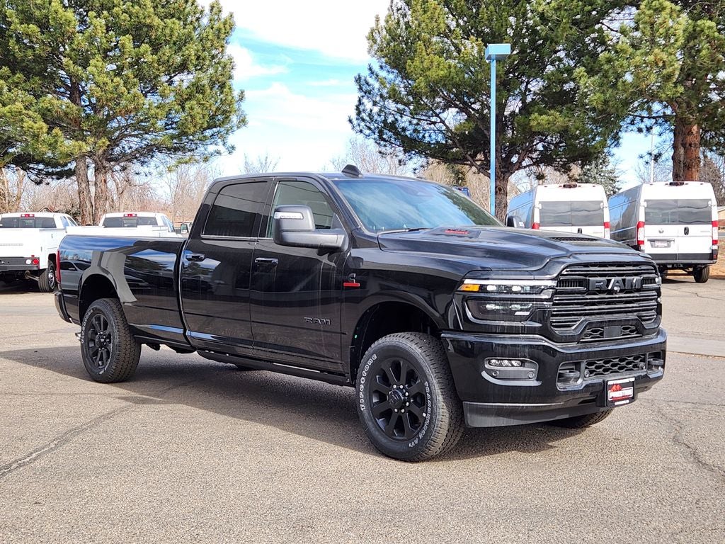 2026 RAM 3500 RAM 3500 LARAMIE CREW CAB 4X4 8' BOX in Diamond Black Crystal Pearl-Coat Exterior Paint — front three-quarter view