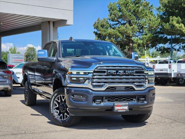 2026 RAM 3500 RAM 3500 LIMITED LONGHORN CREW CAB 4X4 8' BOX in Forged Blue Metallic Exterior Paint — front three-quarter view