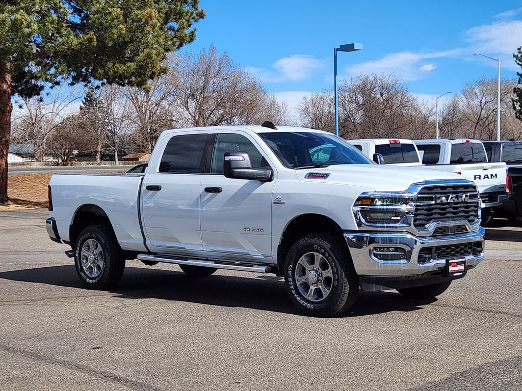 2026 RAM 2500 RAM 2500 BIG HORN CREW CAB 4X4 6'4' BOX in Bright White Clear-Coat Exterior Paint — front three-quarter view