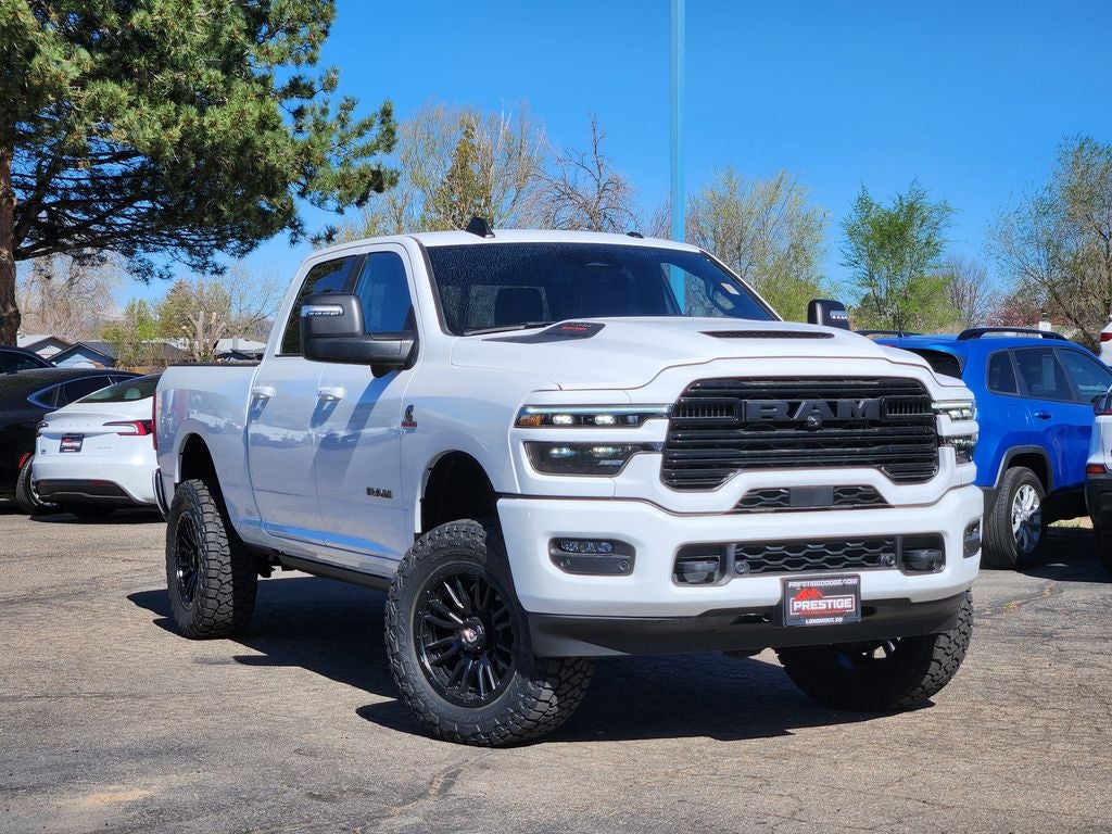 2025 RAM 2500 RAM 2500 LARAMIE CREW CAB 4X4 6'4' BOX in Bright White Clear-Coat Exterior Paint — front three-quarter view