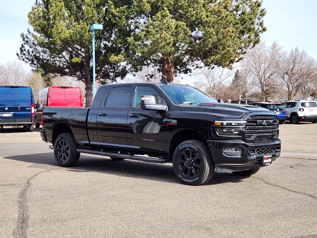 2026 RAM 2500 RAM 2500 LARAMIE MEGA CAB 4X4 6'4' BOX in Diamond Black Crystal Pearl-Coat Exterior Paint — front three-quarter view