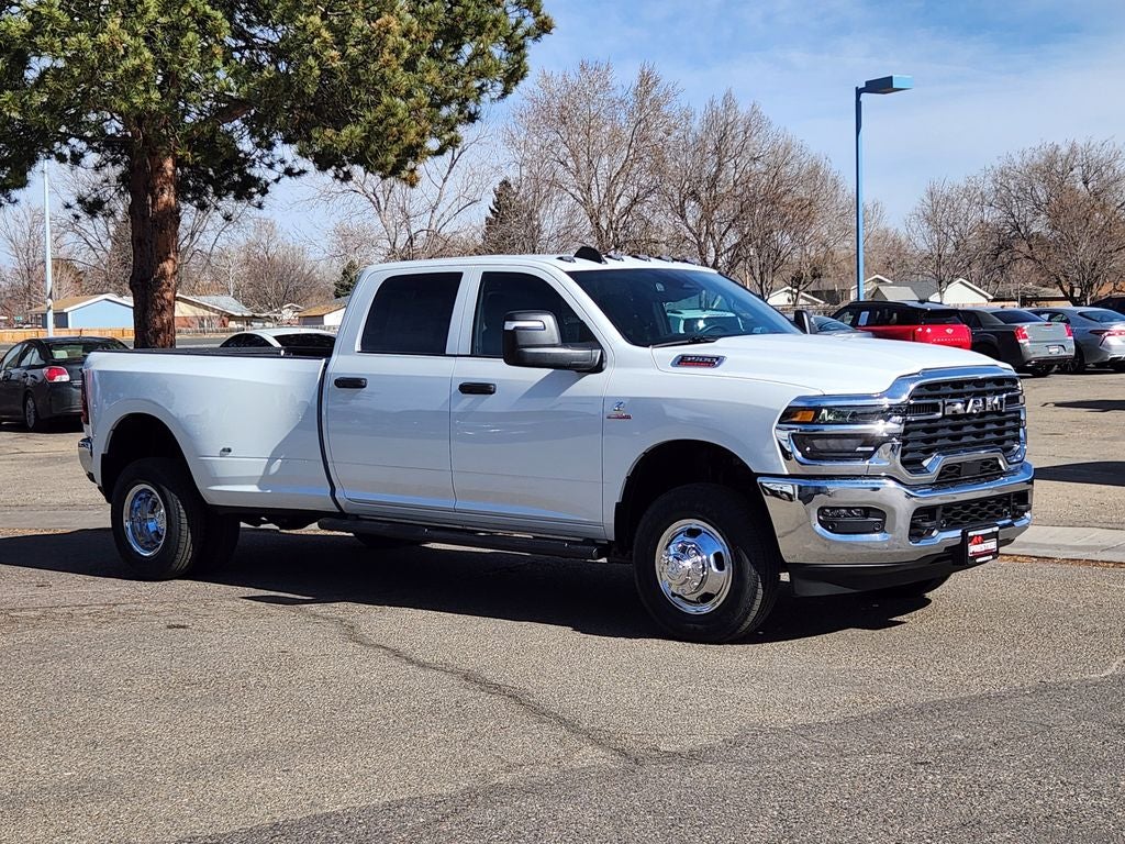 2026 RAM 3500 RAM 3500 TRADESMAN CREW CAB 4X4 8' BOX in Bright White Clear-Coat Exterior Paint — front three-quarter view