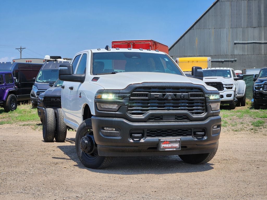 2026 RAM 3500 Chassis Cab RAM 3500 TRADESMAN CREW CAB CHASSIS 4X4 60' CA in Bright White Clear-Coat Exterior Paint — front three-quarter...